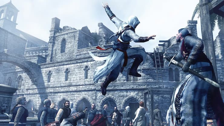 Altair jumping through the air to attack a guard with a sword, surrounded by a crowd in a medieval street setting, with stone buildings in the background from Assassin's Creed 1.